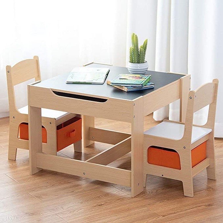 Wooden kids table and chair set with orange storage bins