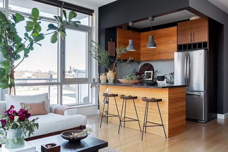 black kitchen with wooden built-ins