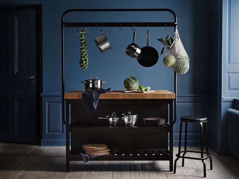 navy blue kitchen with galley trolly in the center