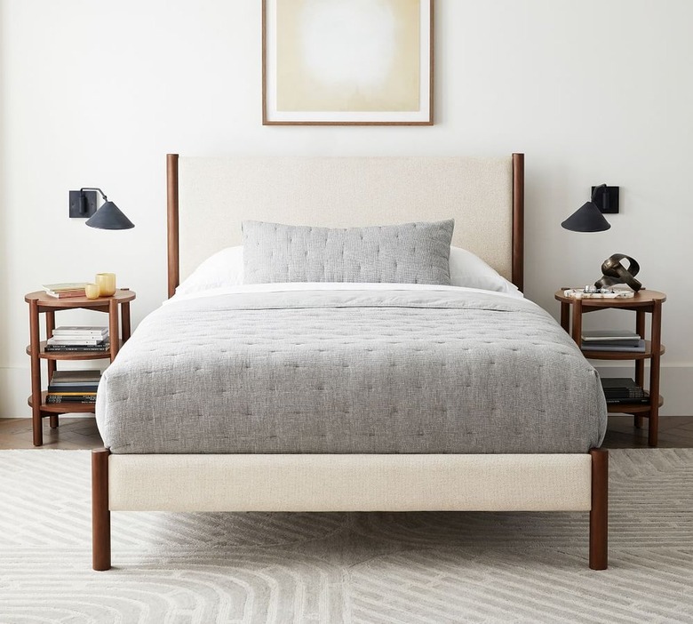 beige linen and walnut wood platform bed with headboard