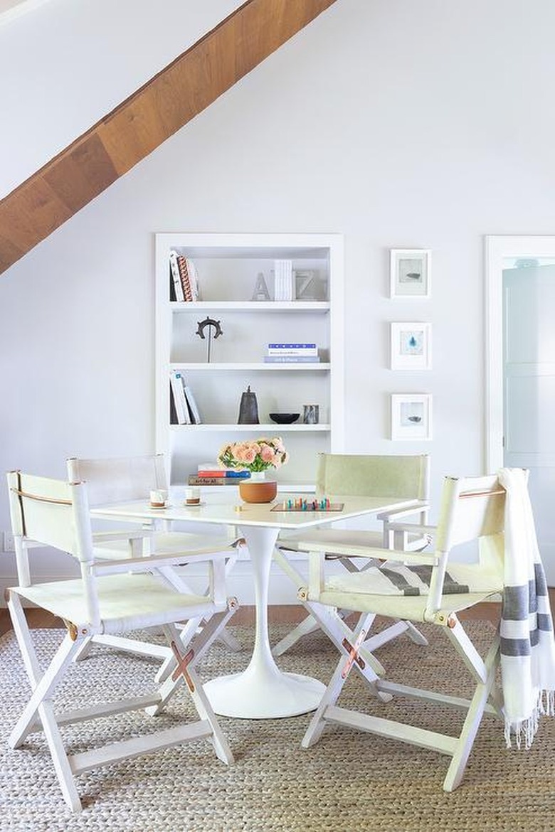 lofty space with director chairs and game table