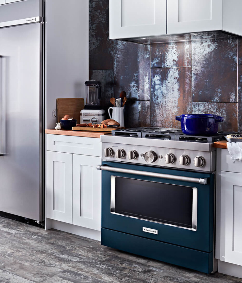 stove brand KitchenAid with teal stove in a gray kitchen