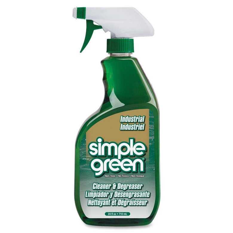 Green spray bottle with white nozzle