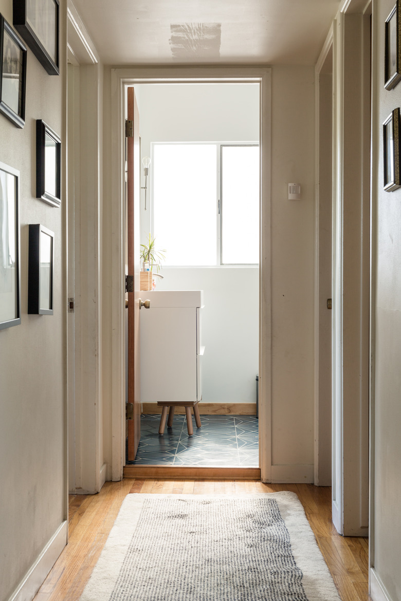 Taupe color in hallway with gallery wall