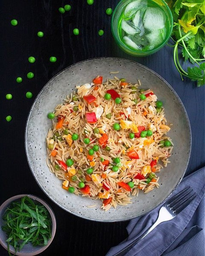 Microwaved egg fried rice on a gray plate