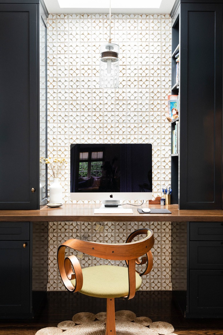 modern office nook with floating shelf desk and apple computer