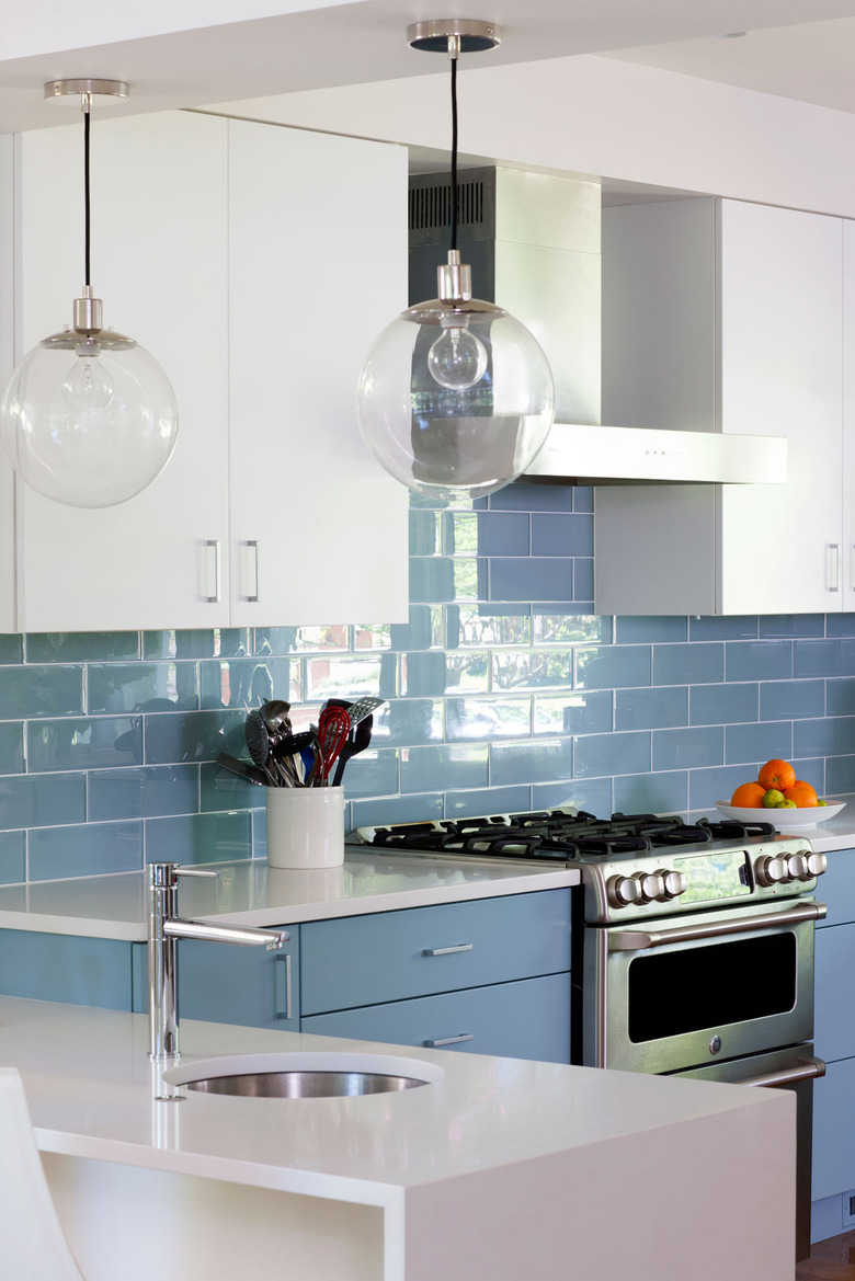 blue kitchen backsplash idea with blue and white cabinets