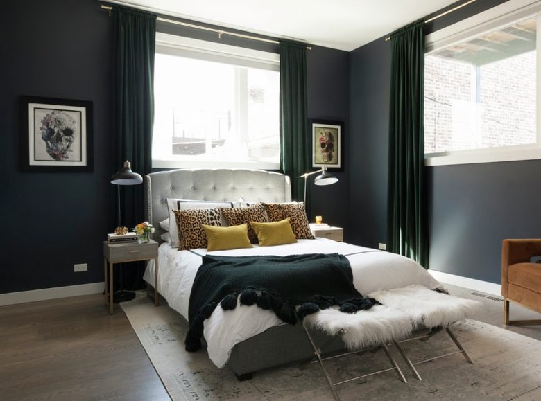 black walls in bedroom with white bed linen