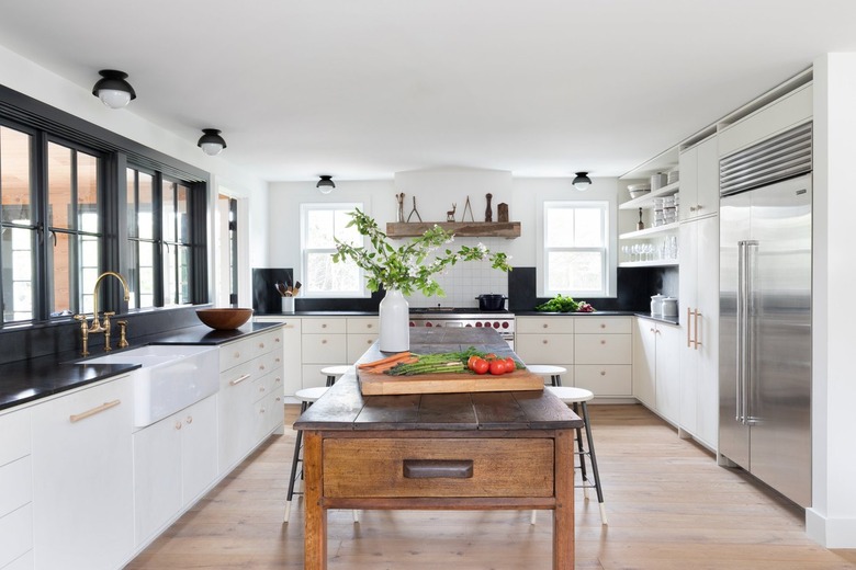 black and white kitchen with hand hewn elongated island