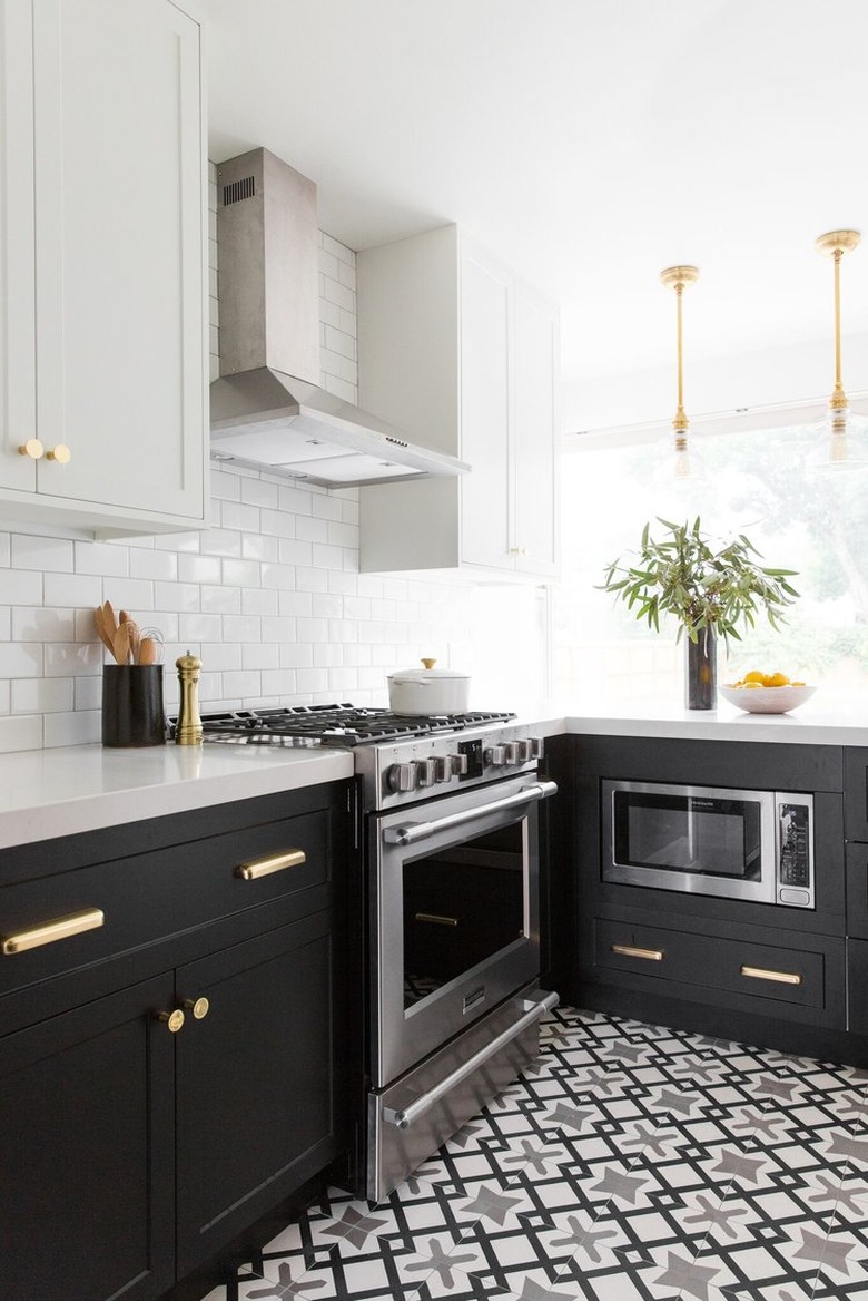 black and white kitchen with encaustic floor tile