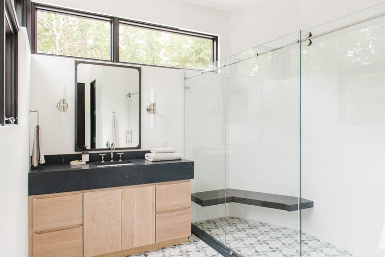 modern bathroom with black countertops