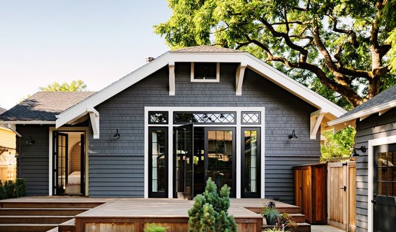 black craftsman house with white trim