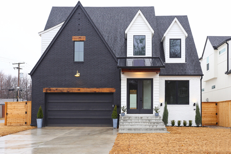 craftsman style house painted in black and white