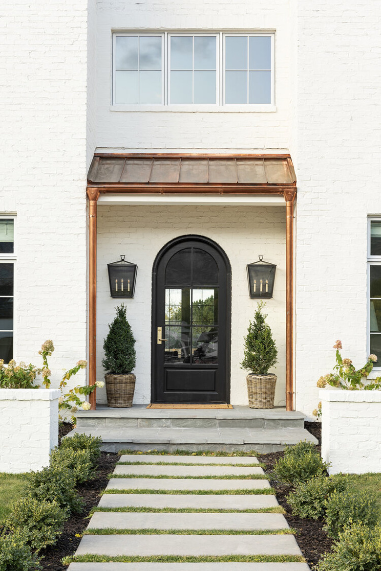 black exterior door idea with arched shape for white house