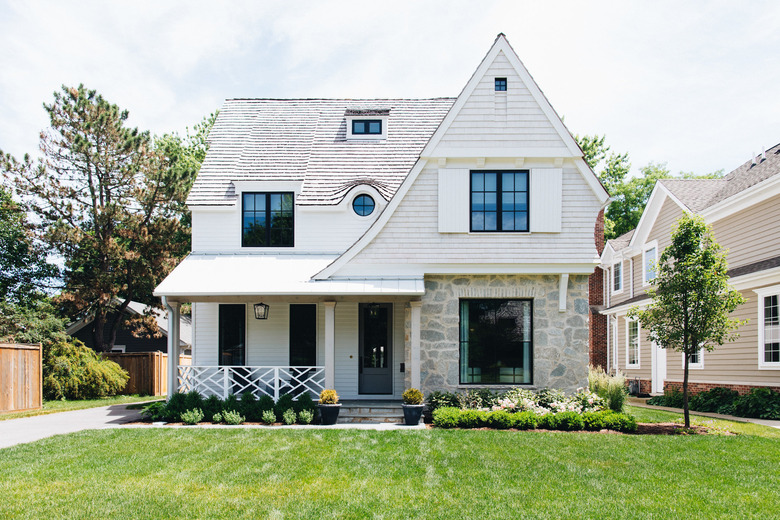 black exterior door idea for white house with green lawn