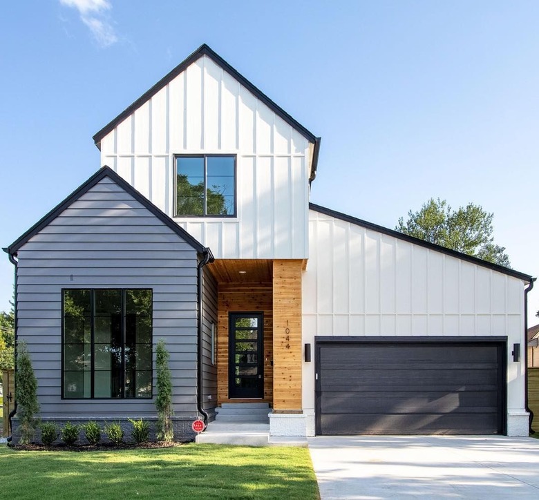 white and gray exterior with black garage door