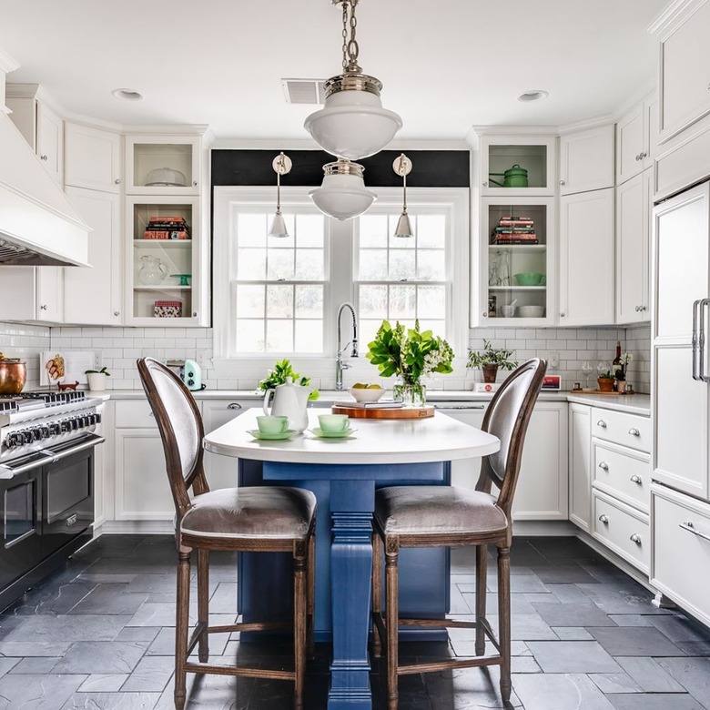 Black kitchen floor featuring slate in various sizes