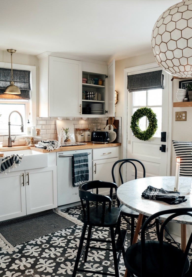 Black kitchen floor in black and white tile and farmhouse details