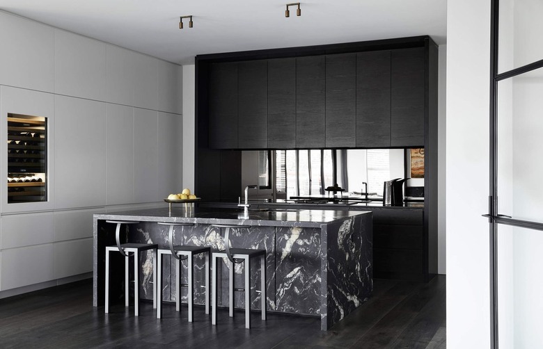 black kitchen floor with black wood cabinets and black island