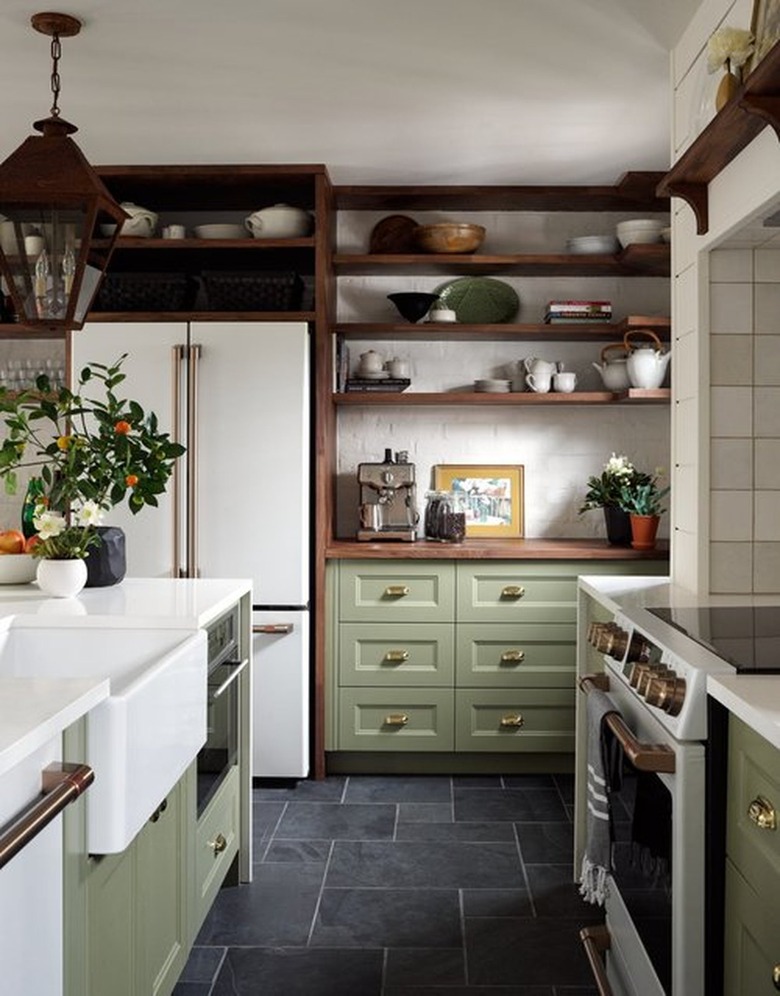 black kitchen floor with green cabinets