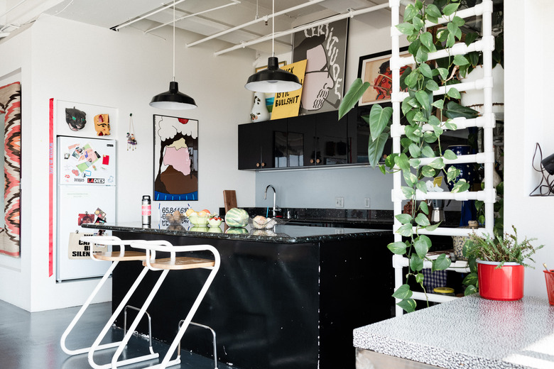 industrial style kitchen with black island