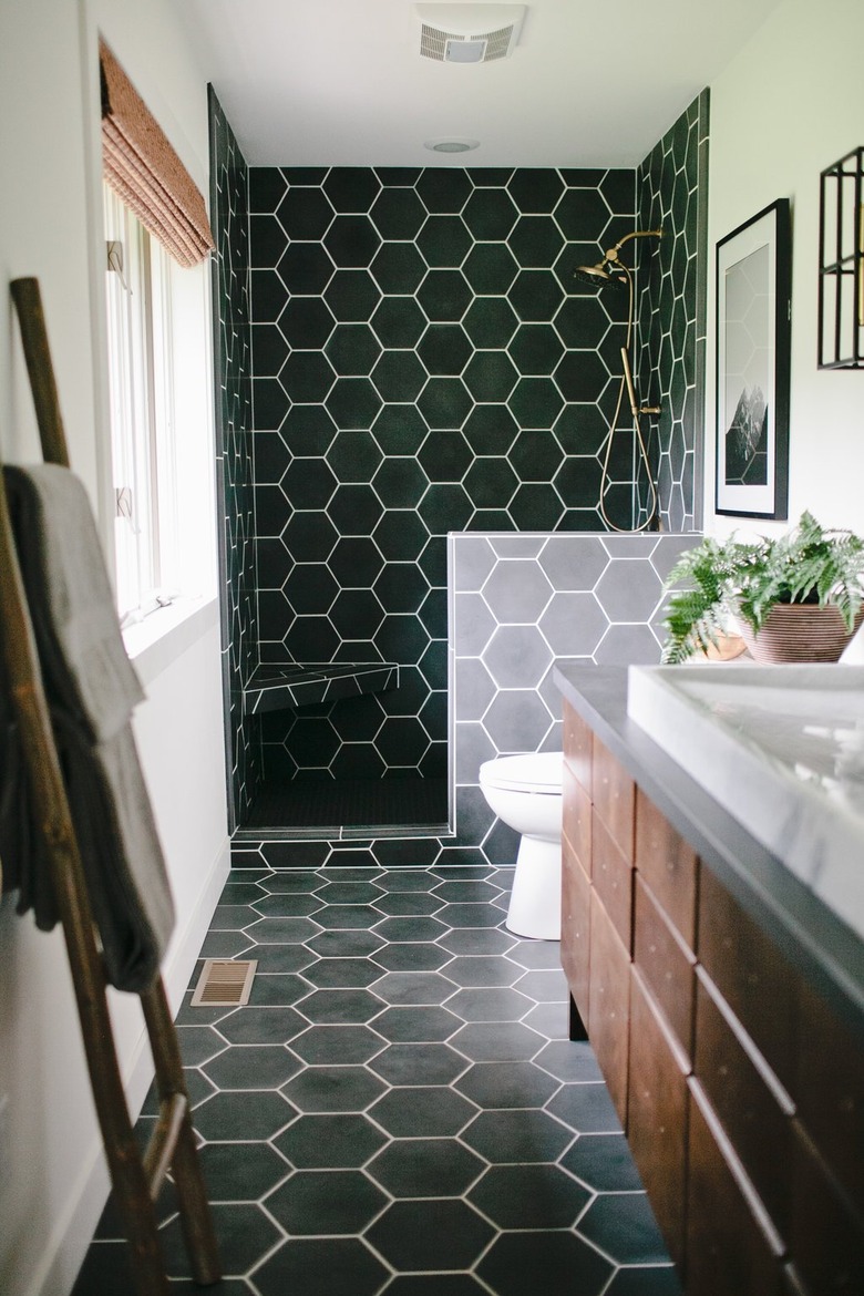 contemporary hex black tile shower with corner bench