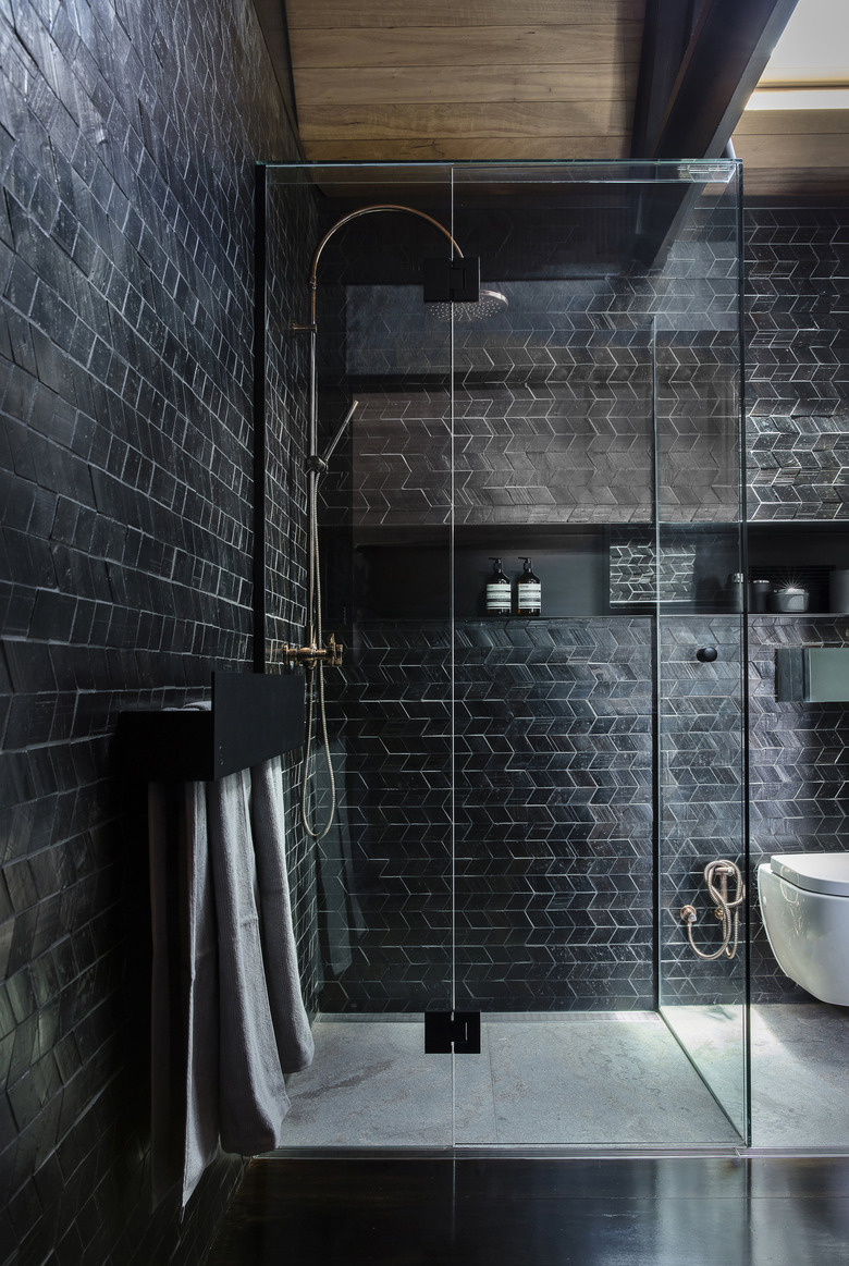 contemporary black tile shower with glass doors