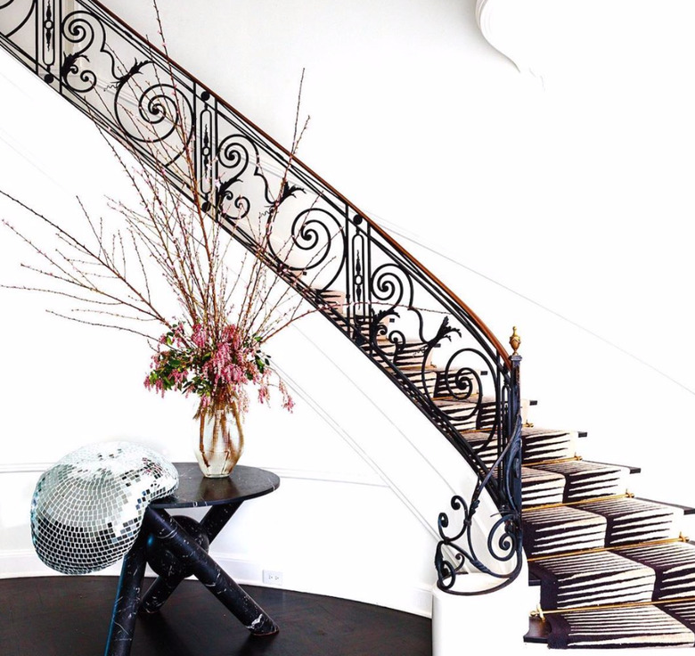 ornate black stair railing for maximalist staircase