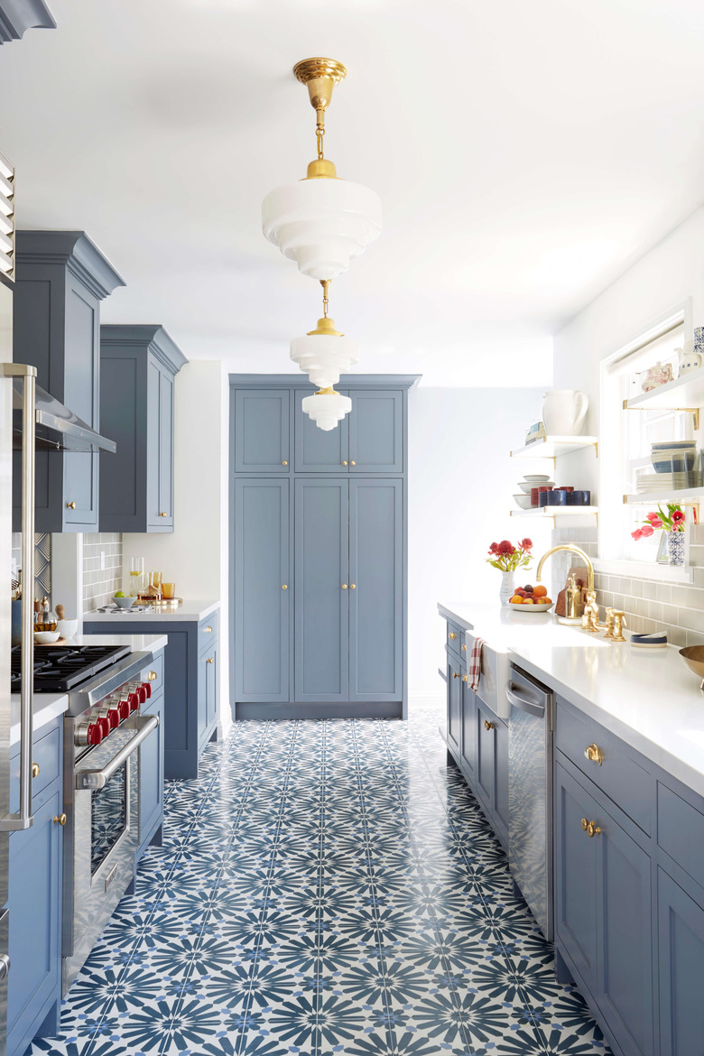 blue and white kitchen with statement blue and white tiled floor