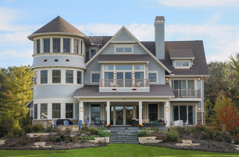 light blue home exterior on Queen Anne architecture with off-white trim