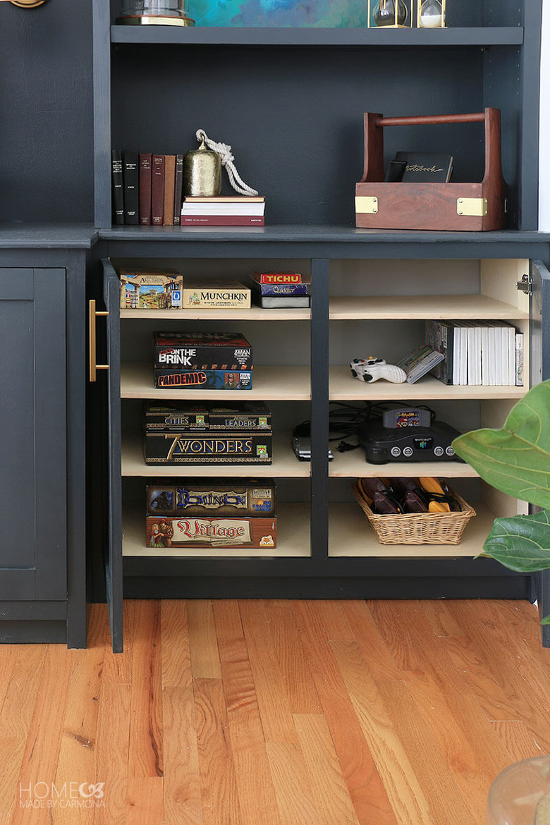 family room media center with drawers for board game storage