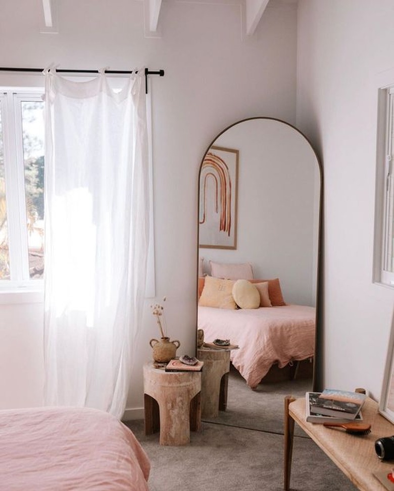 pale boho beach bedroom with wooden textures and earthy tones