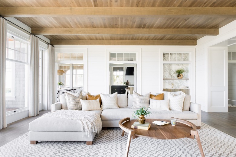 boho coastal living room with wood ceiling neutral furniture