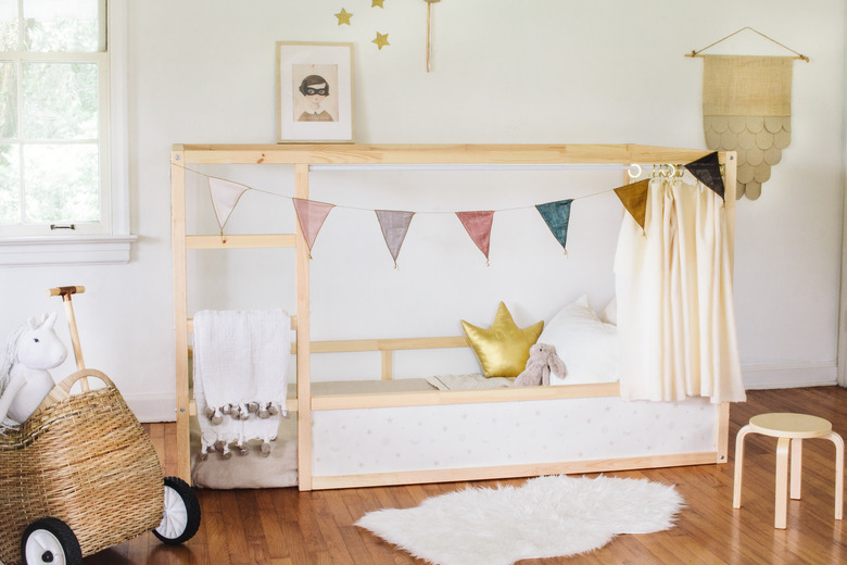 boho girls room with pennant flag, neutral space