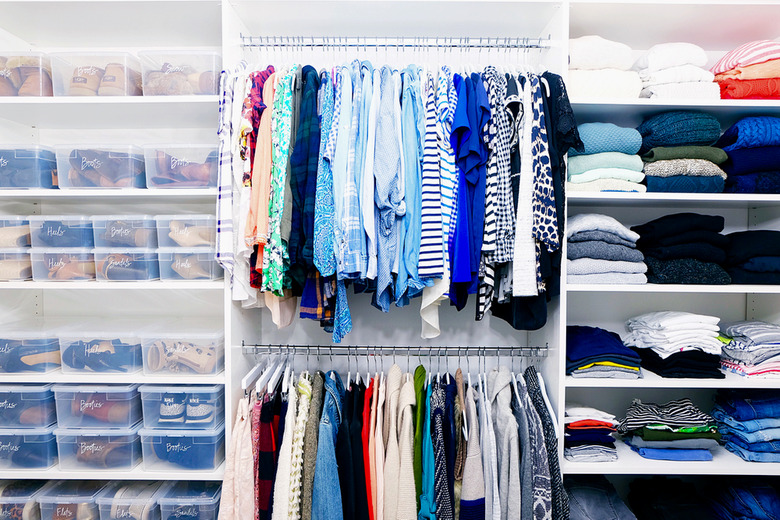 organized closet with lidded shoe storage on the side