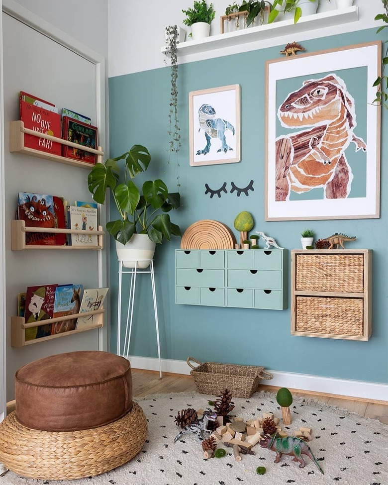 Jurassic themed boys bedroom idea with blue walls and potted plants