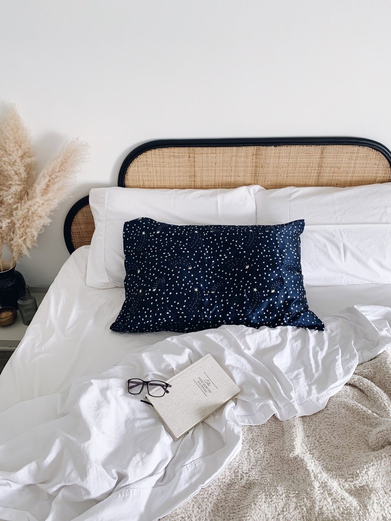 Brooklinen Mulberry Silk Pillowcase in Celestial on bed