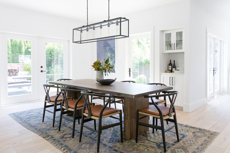 dining room with dark table and glass doors