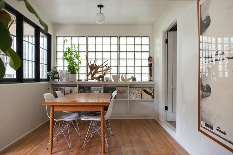 dining room area with built in storage and plants