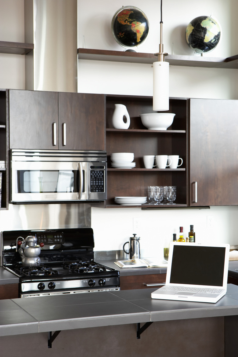 Laptop on counter in domestic kitchen