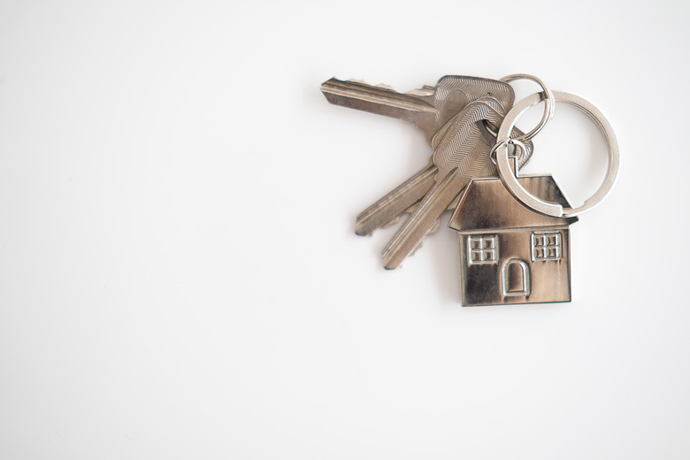 Businessman Holding House Keys