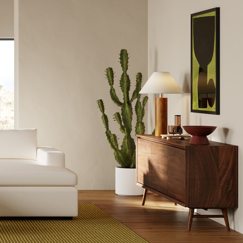 well-designed living room with wooden buffet table