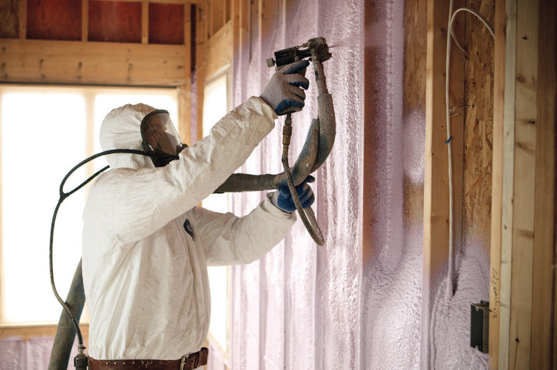 Spray insulation being installed.