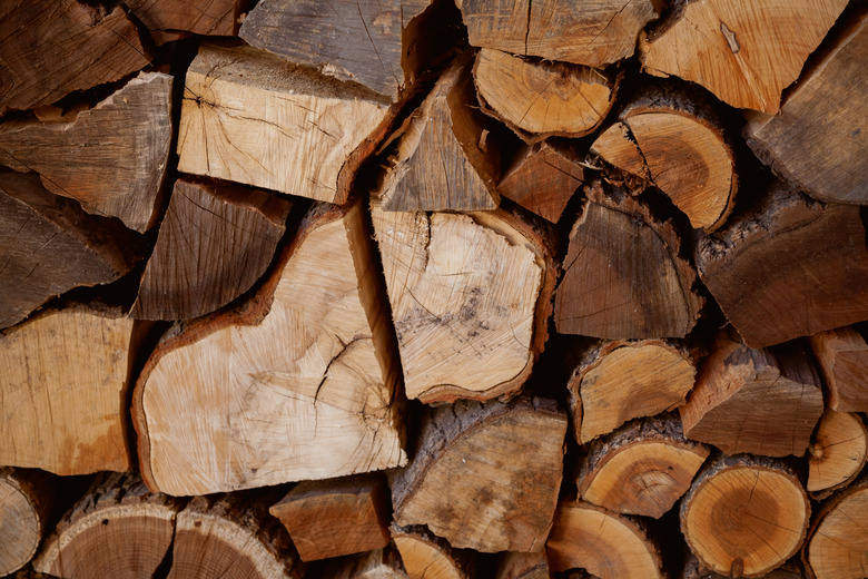 Chopped firewood stacked in rows close-up