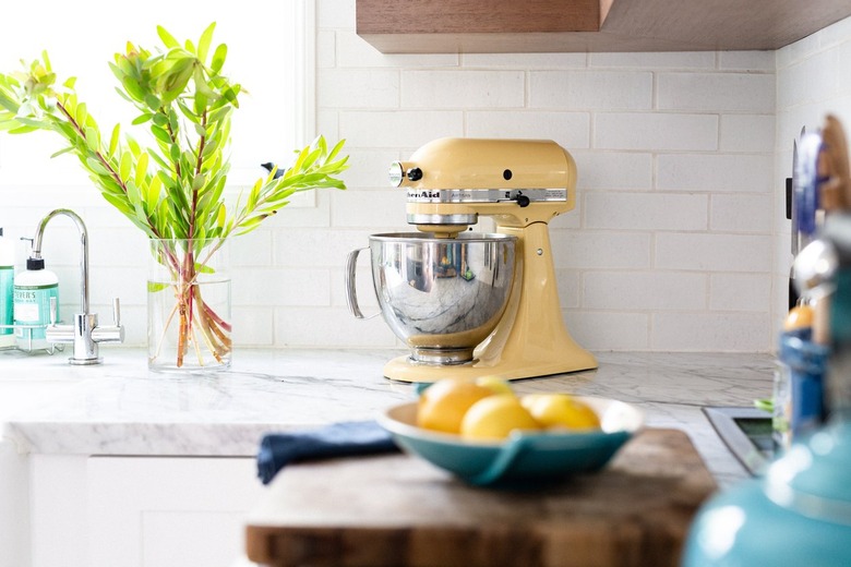 kitchen with yellow stand up mixer on countertop