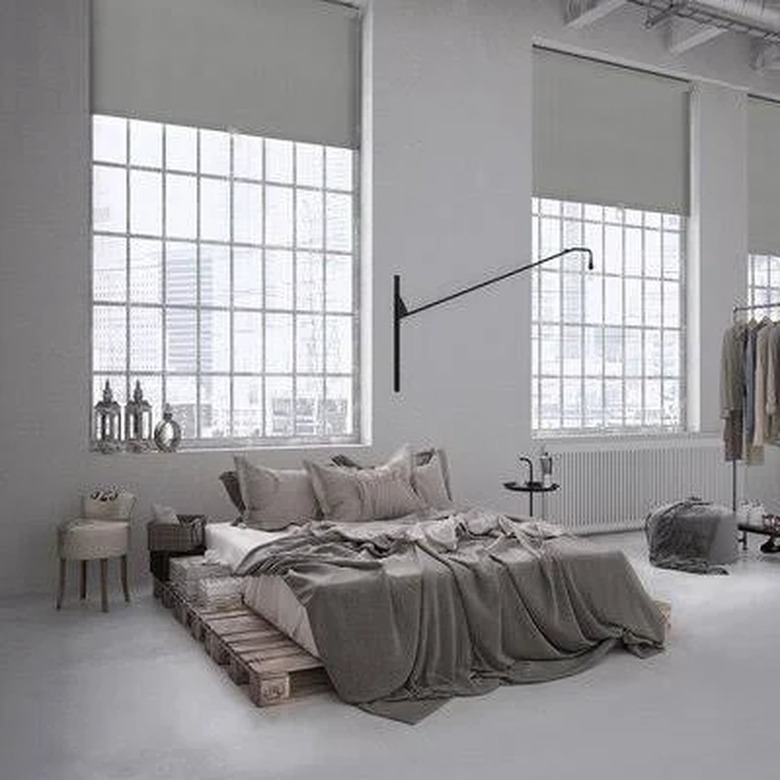 Roller blinds in a loft-style bedroom