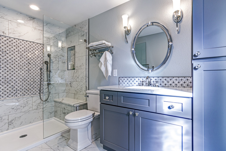 New blue bathroom design with Marble shower Surround