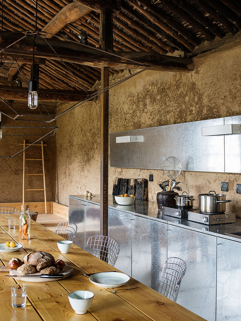 rustic kitchen with stainless steel cabinets