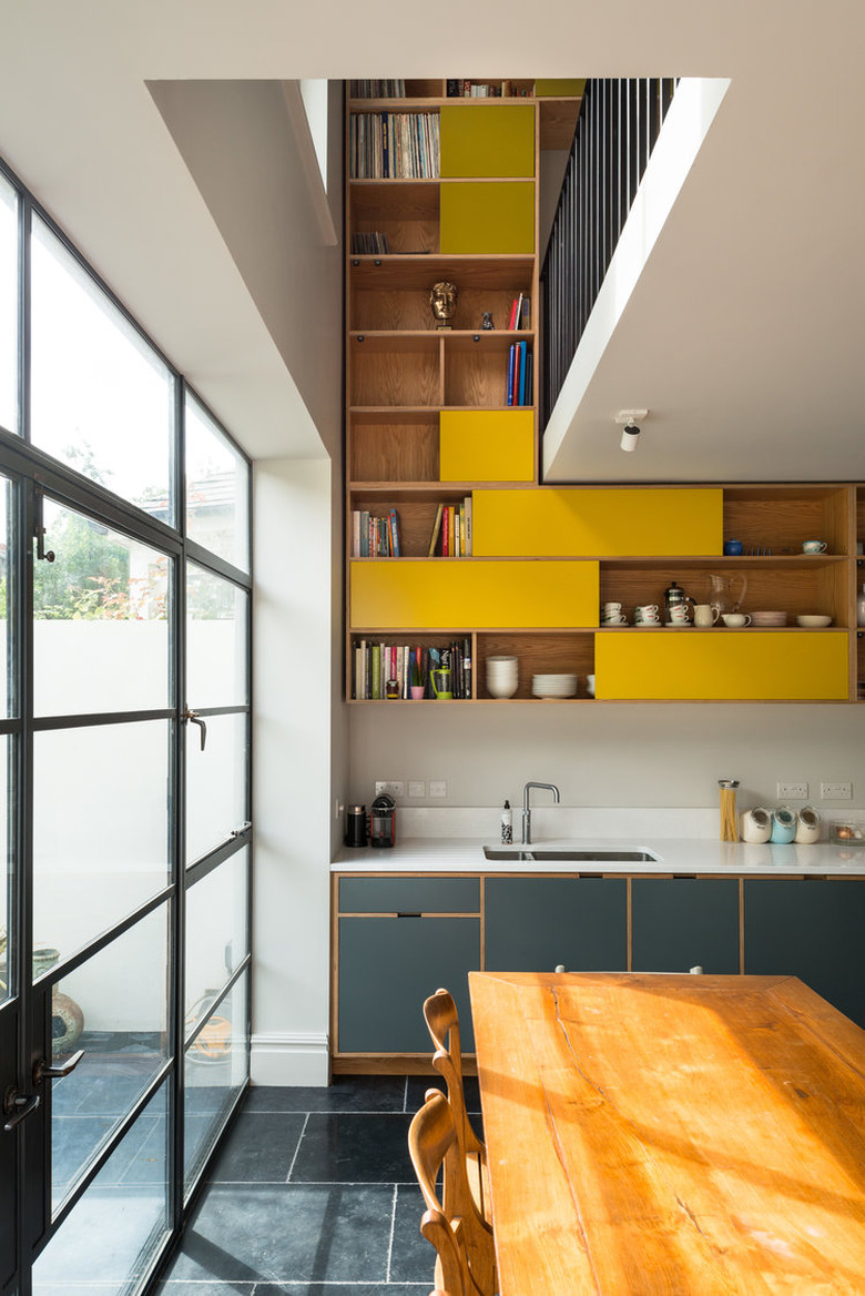 yellow kitchen cabinet idea with lower blue cabinets and upper yellow cabinets