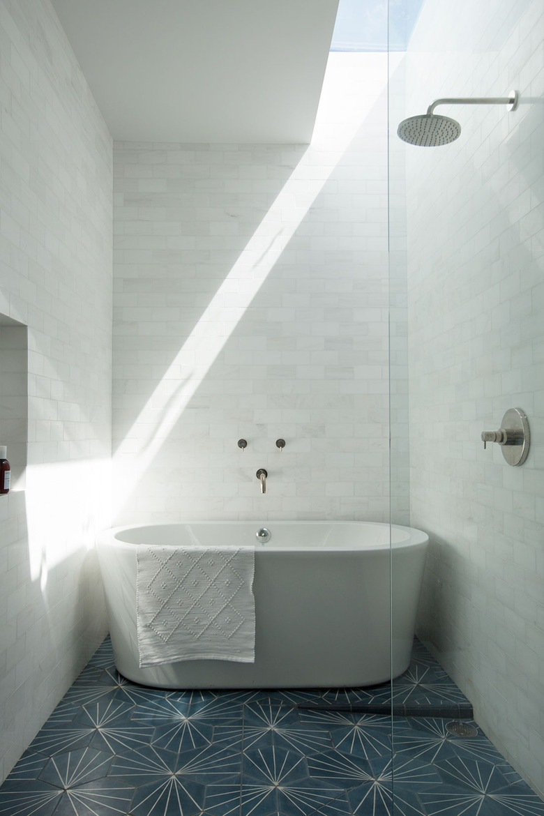 teal geometric tile bathroom floor